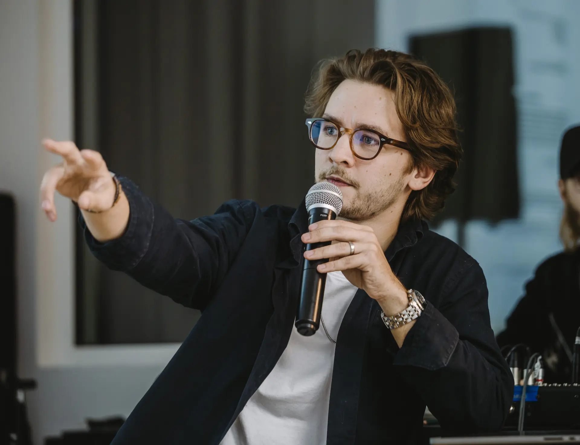 Close up of a participant asking a question on the mic